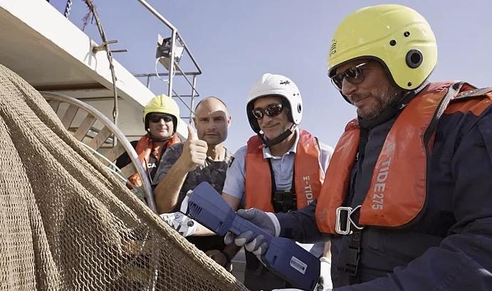 inspection team on the fishing boats at sea
